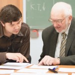 Senior professor discusses an issue with a student