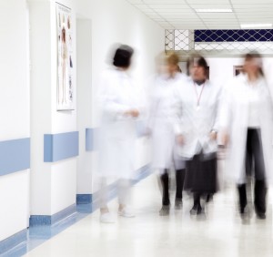 shutterstock_45616333 blurred busy doctors in hospital