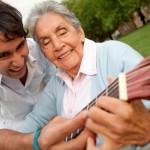 shutterstock_62314828 old woman plays guitar