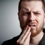 shutterstock_73929085 dental pain bearded man