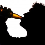 shutterstock_63718723 man drinking bottle of beer