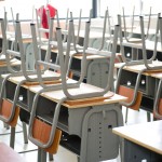 Classroom chairs stacked on tables