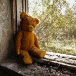 Teddy bear in war zone