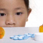 Young girl with pills