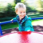 Young boy on roundabout