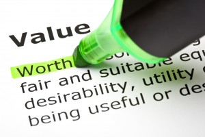 Green highlighter pen highlighting the word worth