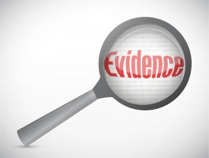 Magnifying glass over the word evidence