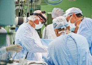 Surgeons operating on a patient