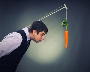 Man with a carrot dangling in front of him