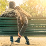 Couple sitting on park bench