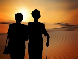 Two older people silhouetted