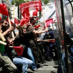 Protesters clash with policemen during riots at a May Day rally in Athens May 1, 2010. Angry protesters set fire to garbage cans and two TV outside broadcast vans in Athens as thousands of Greeks marched through the capital on May Day to protest against austerity measures they say only hurt the poor.  REUTERS/Icon/Panagiotis Tzamaros  (GREECE - Tags: POLITICS BUSINESS CIVIL UNREST EMPLOYMENT IMAGES OF THE DAY) GREECE OUT. NO COMMERCIAL OR EDITORIAL SALES IN GREECE