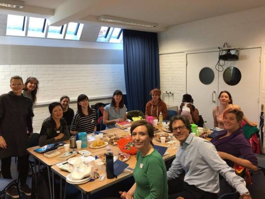 All together during a Maternal Journal session: Laura (first from the left), Hannah (sixth from the left) and Carmine (the only man) sitting on the left of 'Cartoon Kate' Evans. Photo: Martim Ramos.