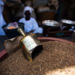 29 September 2013. El Fasher: A trader shows a tray with tombac (chewing tobacco) at the market in El Fasher, North Darfur. Tombac is one of North Darfurs major cash crops. The traditional markets for tombac include South Sudan, Blue Nile and South Kordofan states. Farmers assure four million people in Darfur are dependent on the cultivation and sale of tobacco. They claim that tobacco had been produced in the region since 1850.  Originally, the production of tombac started in Tombouctou (Mali) and later it was imported to Egypt and Darfur.  Photo by Albert González Farran, UNAMID