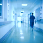 Hospital corridor and doctor as a blurred defocused background