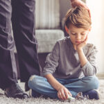 Little,Boy,Is,Playing,A,Toy,Car,And,Looking,Sadly