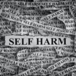 Self,Harm.,Torn,Pieces,Of,Paper,With,The,Words,Self