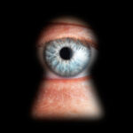 Eye,In,Keyhole,,Isolated,On,Black,Background