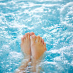 Close-up,Of,Female,Legs,In,Hot,Tub