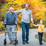Elderly,Father,Adult,Son,And,Grandson,Out,For,A,Walk