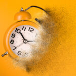 Dissolving orange alarm clock. Dissolving time