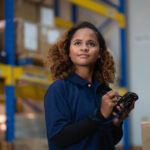Industrial african worker women black  in factory, worker working in warehouse stock checking. suppervisor team control and management. Business factory industry concept. logistics warehouse people.