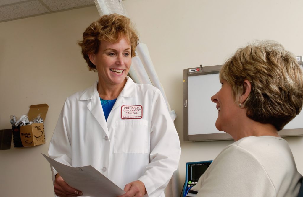 a doctor is smiling at a patient