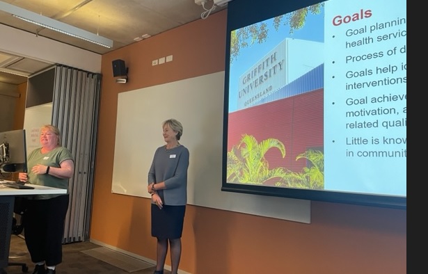 Vicky Stewart (left) and Prof Amanda Wheeler (right) presenting on community the pharmacist's role in goal setting with people with mental illness to support improvements in wellbeing and lifestyle change