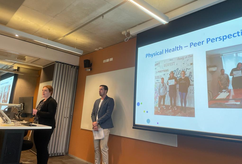 Elena Walker (left) and Matthew Fluder (right) presenting on Walking toward Wellness