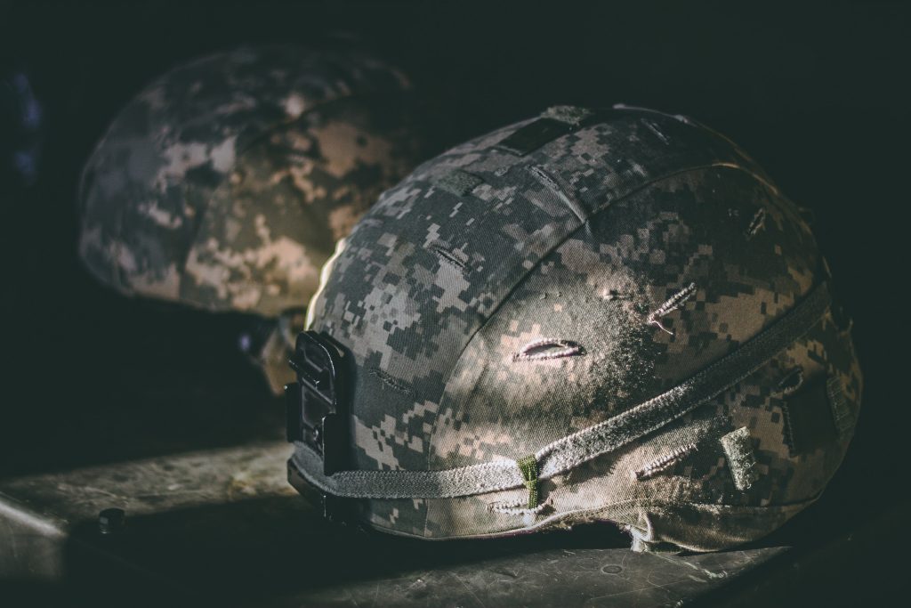 a khaki camouflage army hat 