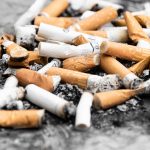 a pile of orange cigarette butts in ash