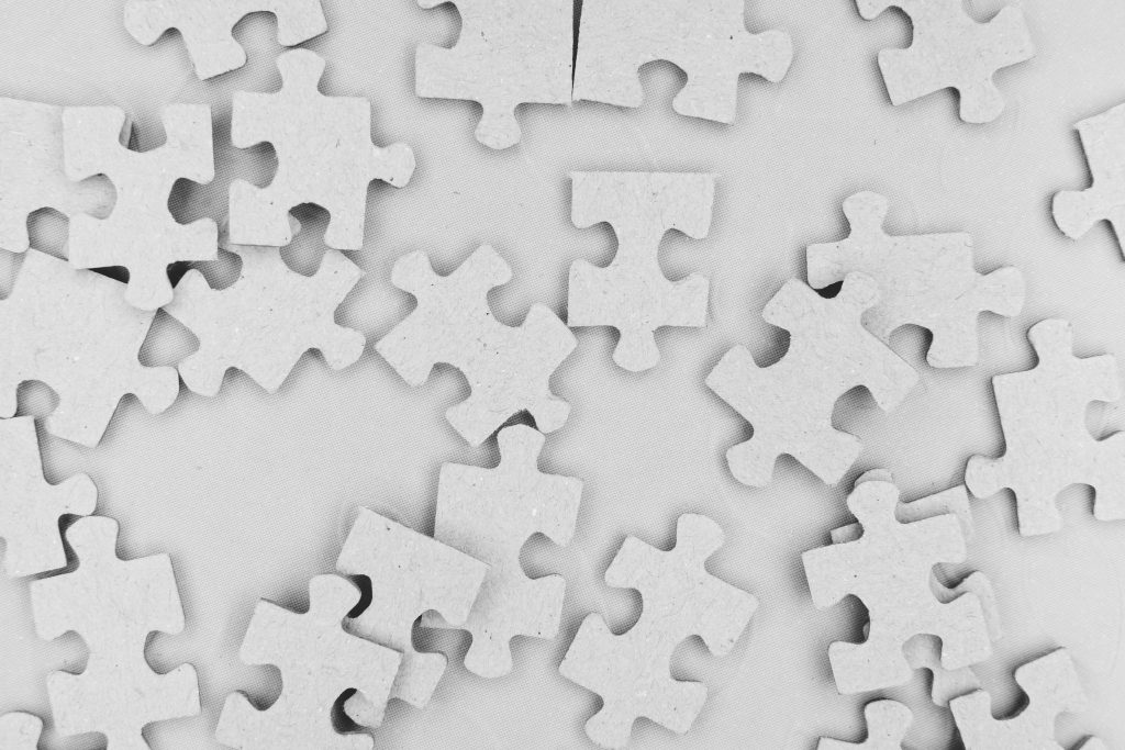 white puzzle pieces on a white background