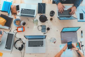 laptops around a desk