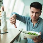 Young,Handsome,Man,Is,Not,Satisfied,With,The,Salad,Showing