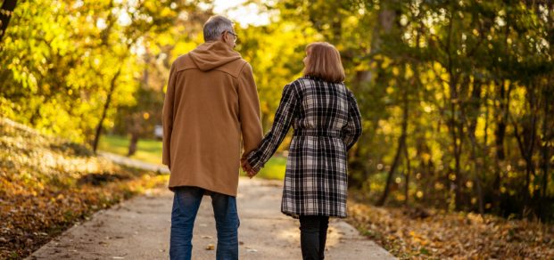 Romantic,Senior,Couple,Is,Walking,In,Park,In,Autumn.
