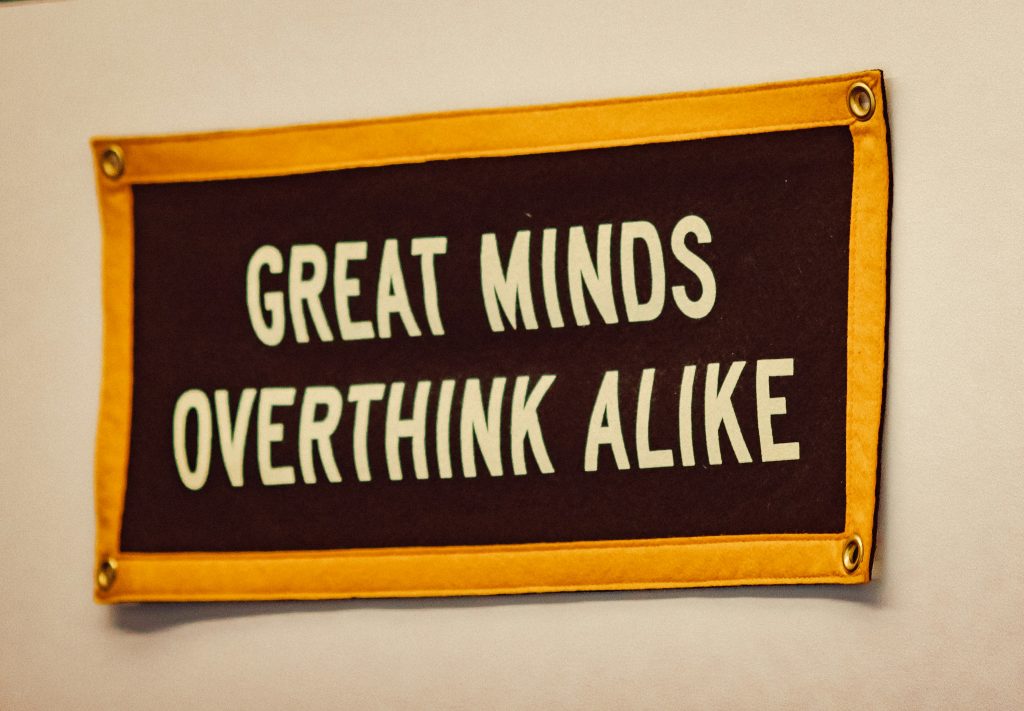 A sign reads great minds overthink alike