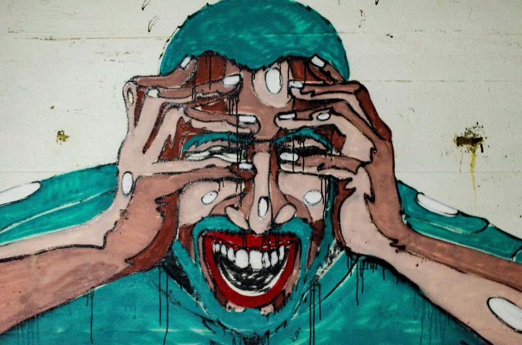 A cartoon image of someone holding their head