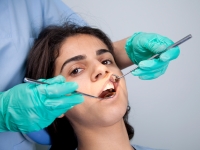 A woman having a dental examination.