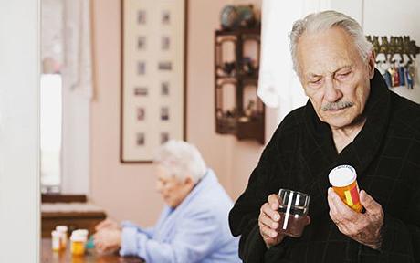 Senior couple taking medication