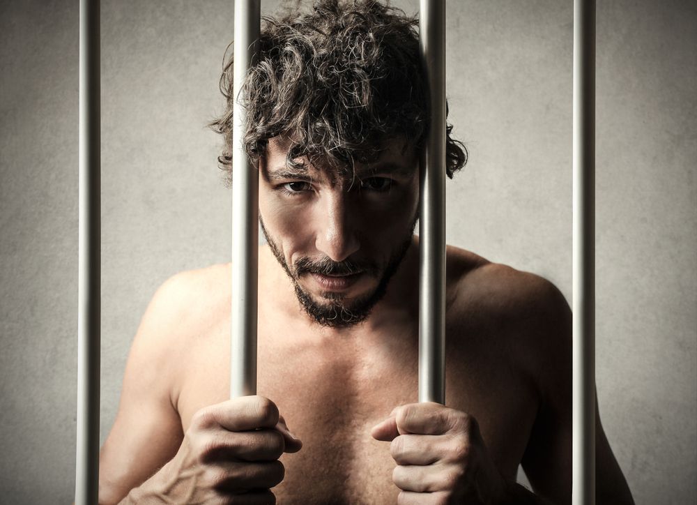 Prisoner behind bars