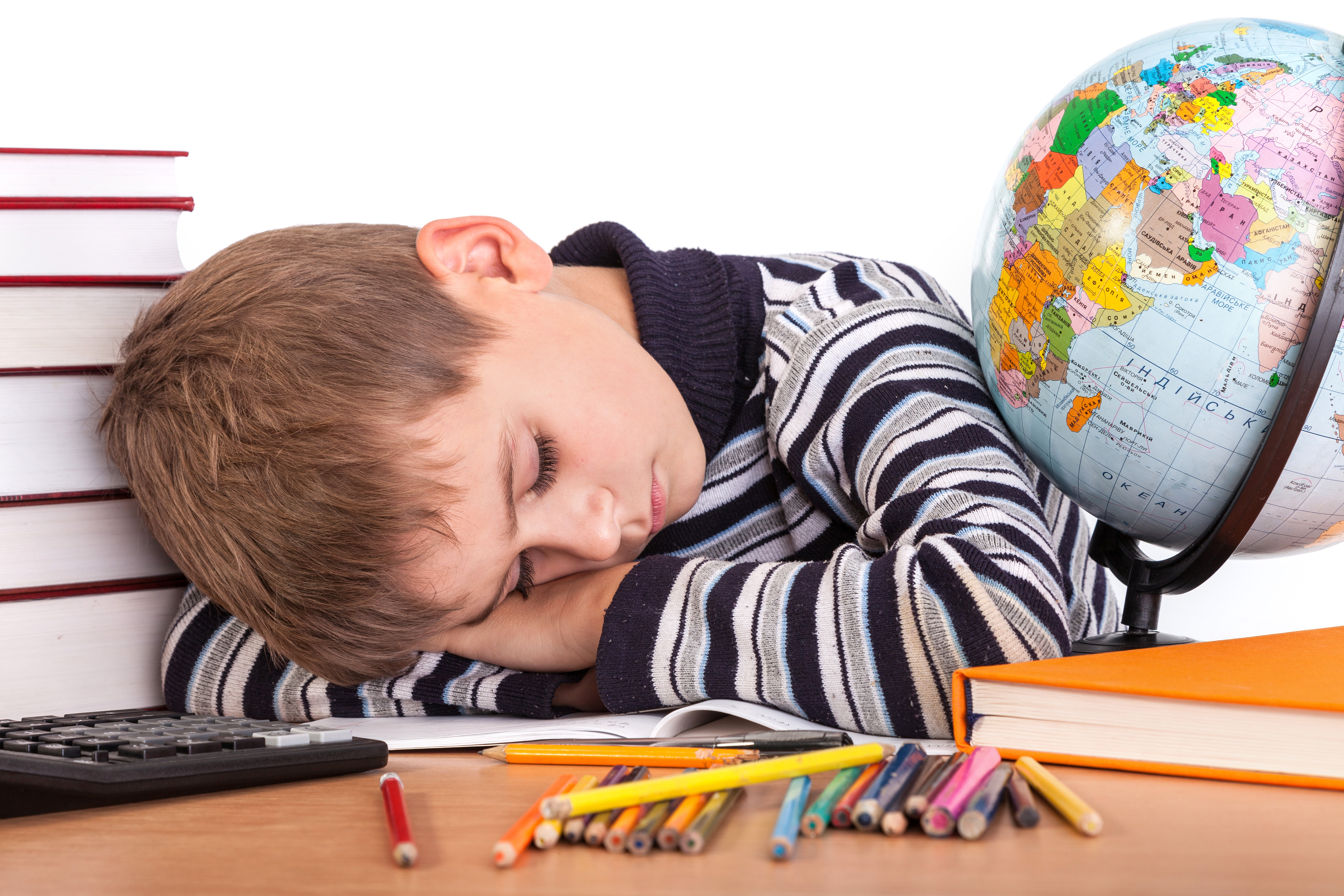 child sleeping on school books