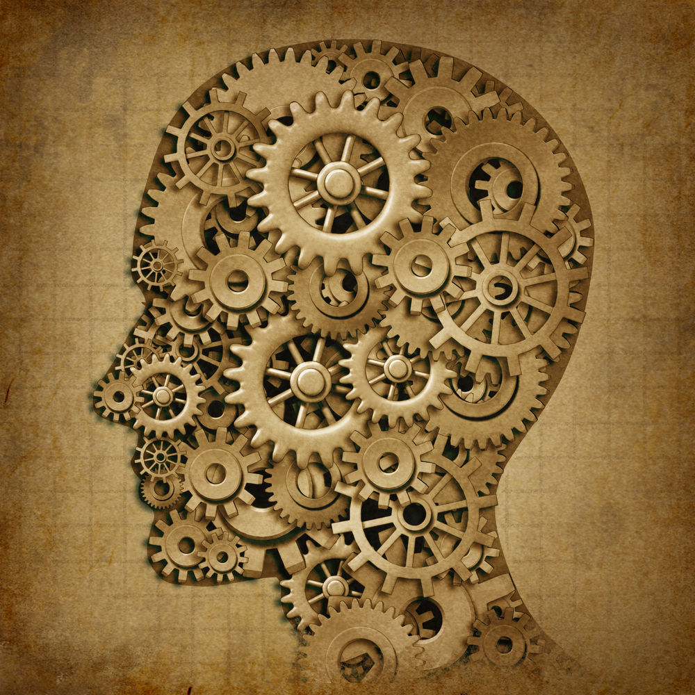 Shape of a head filled with cogs