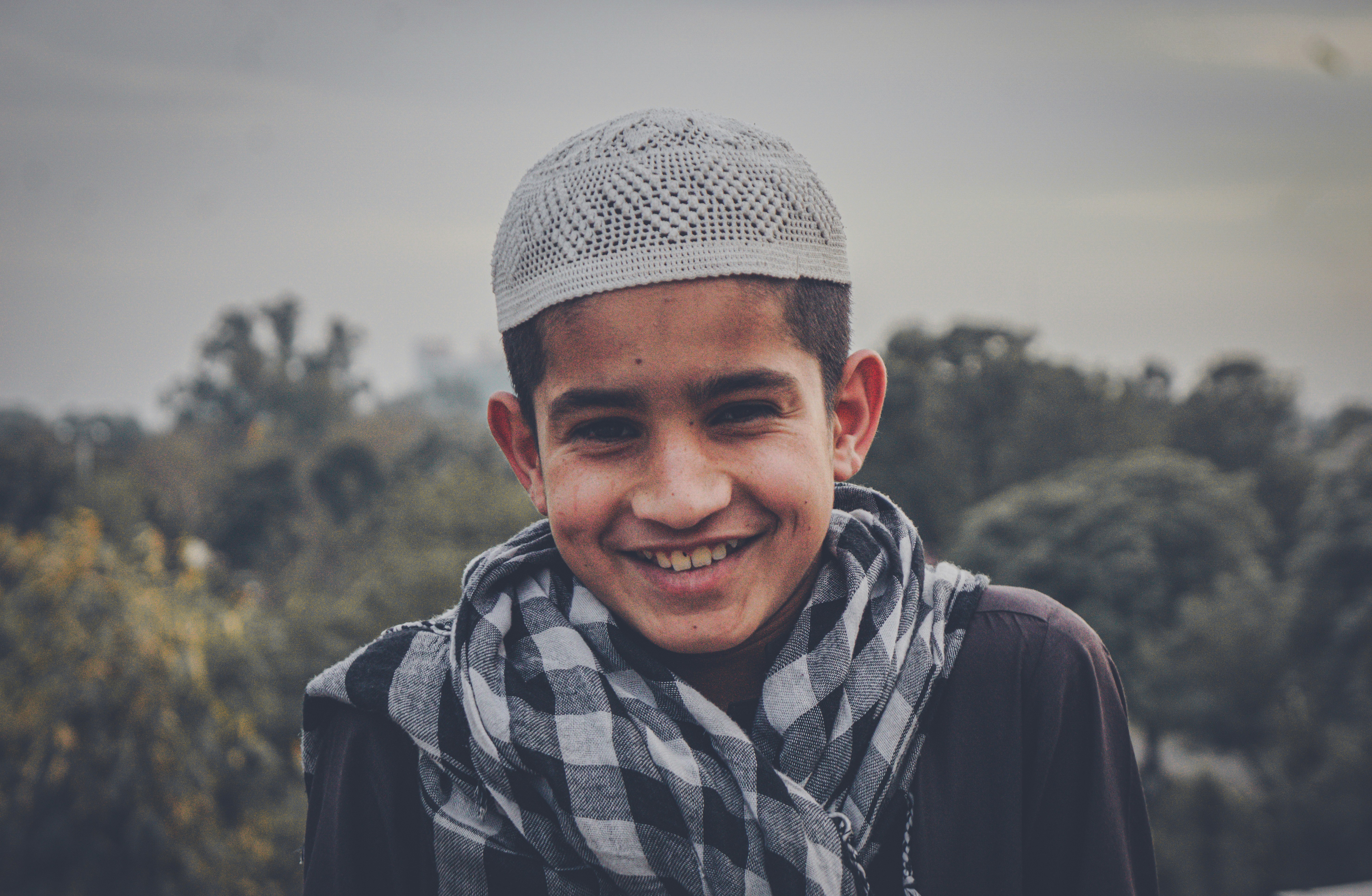 A young person smiling