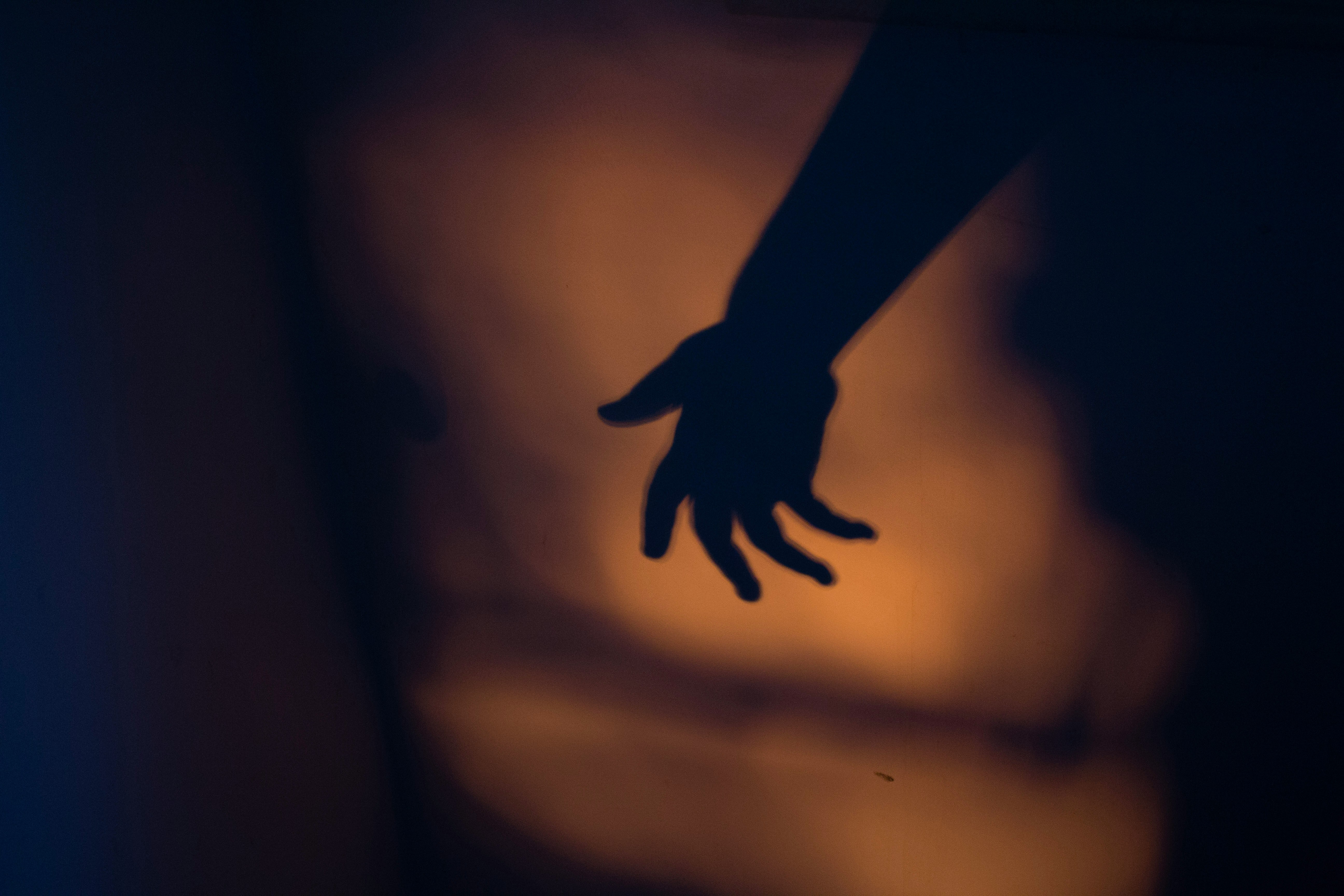 A hand in silhouette
