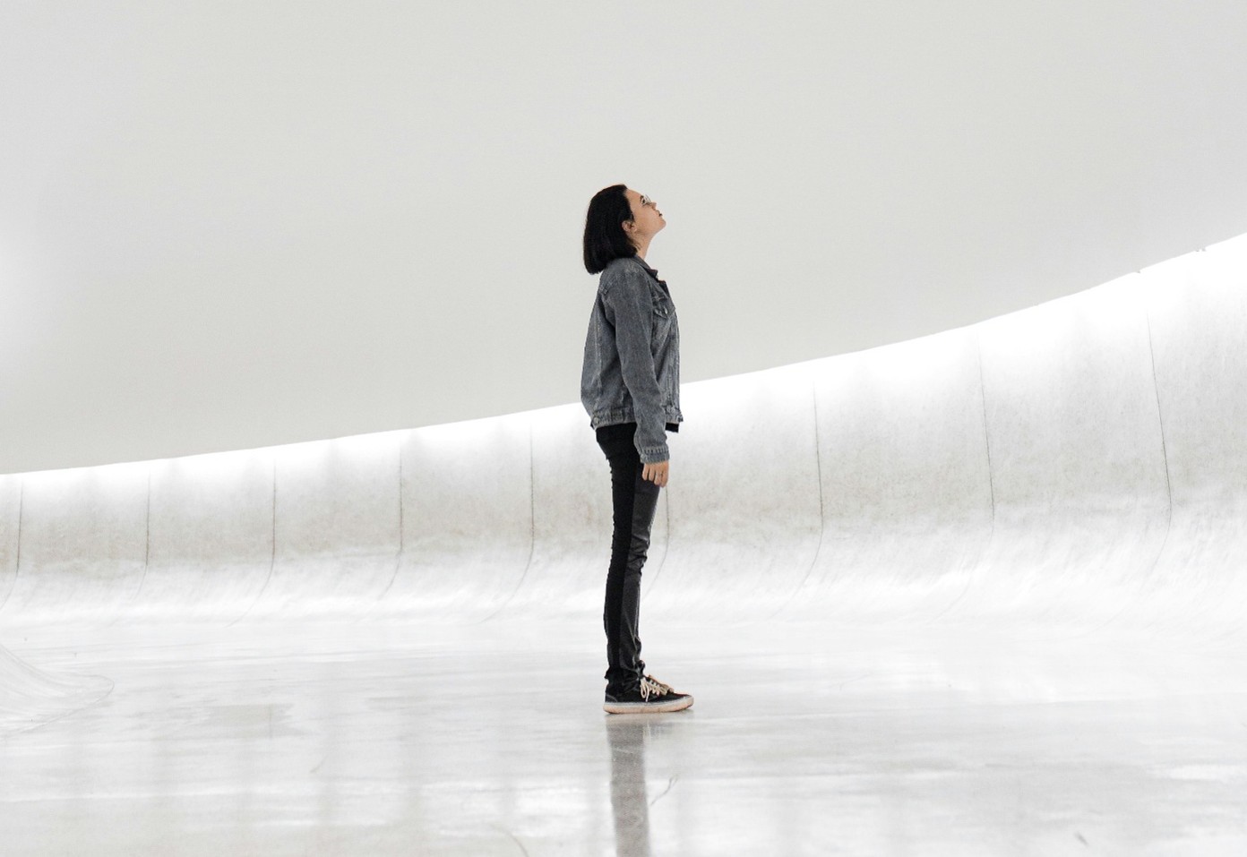 A person gazing up at something out of shot