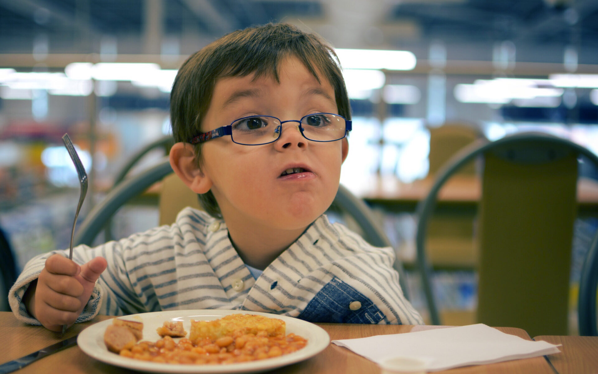 Young boy eating breakfast
