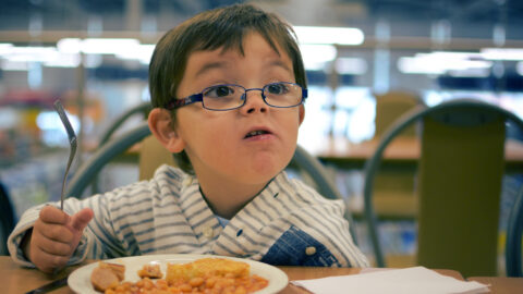 Young boy eating breakfast